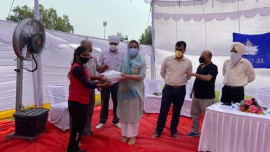 Photo of Mrs Nuzhat Gul secretary J&KSC gave away books and stationary items to budding Hockey Players